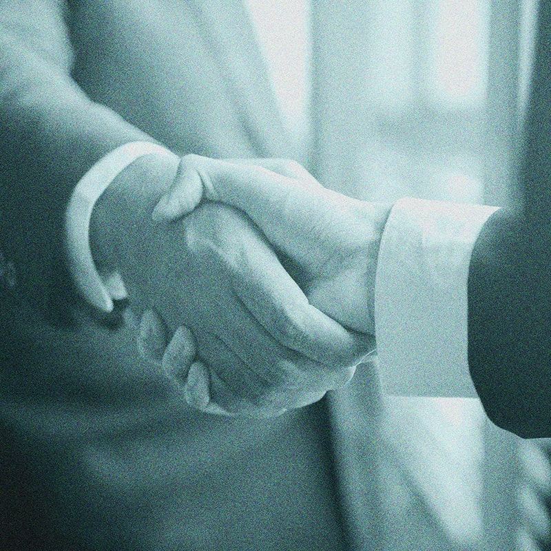 detail image of two businesspeople shaking hands