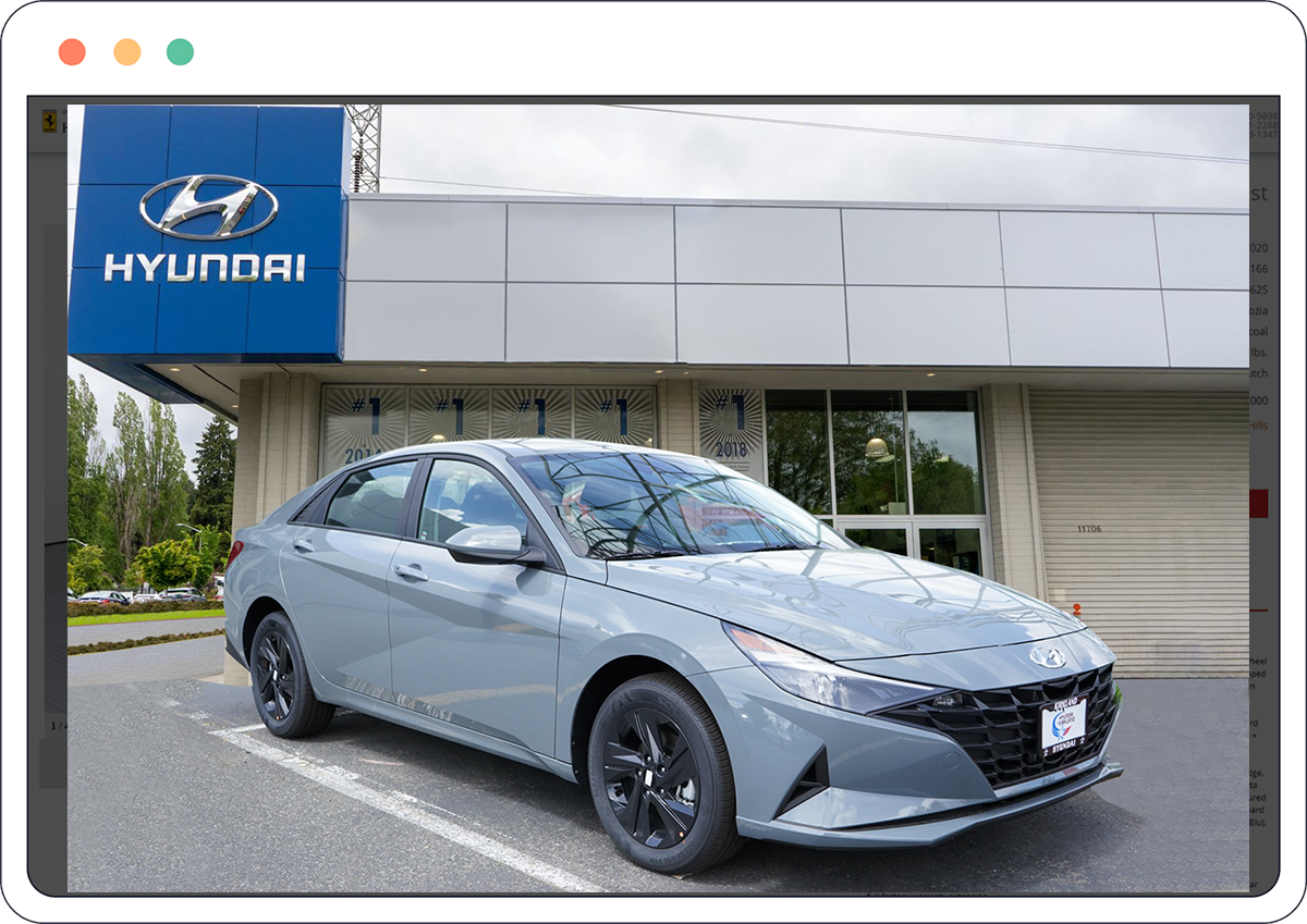 Hyundai car parked in front of a Hyundai dealership